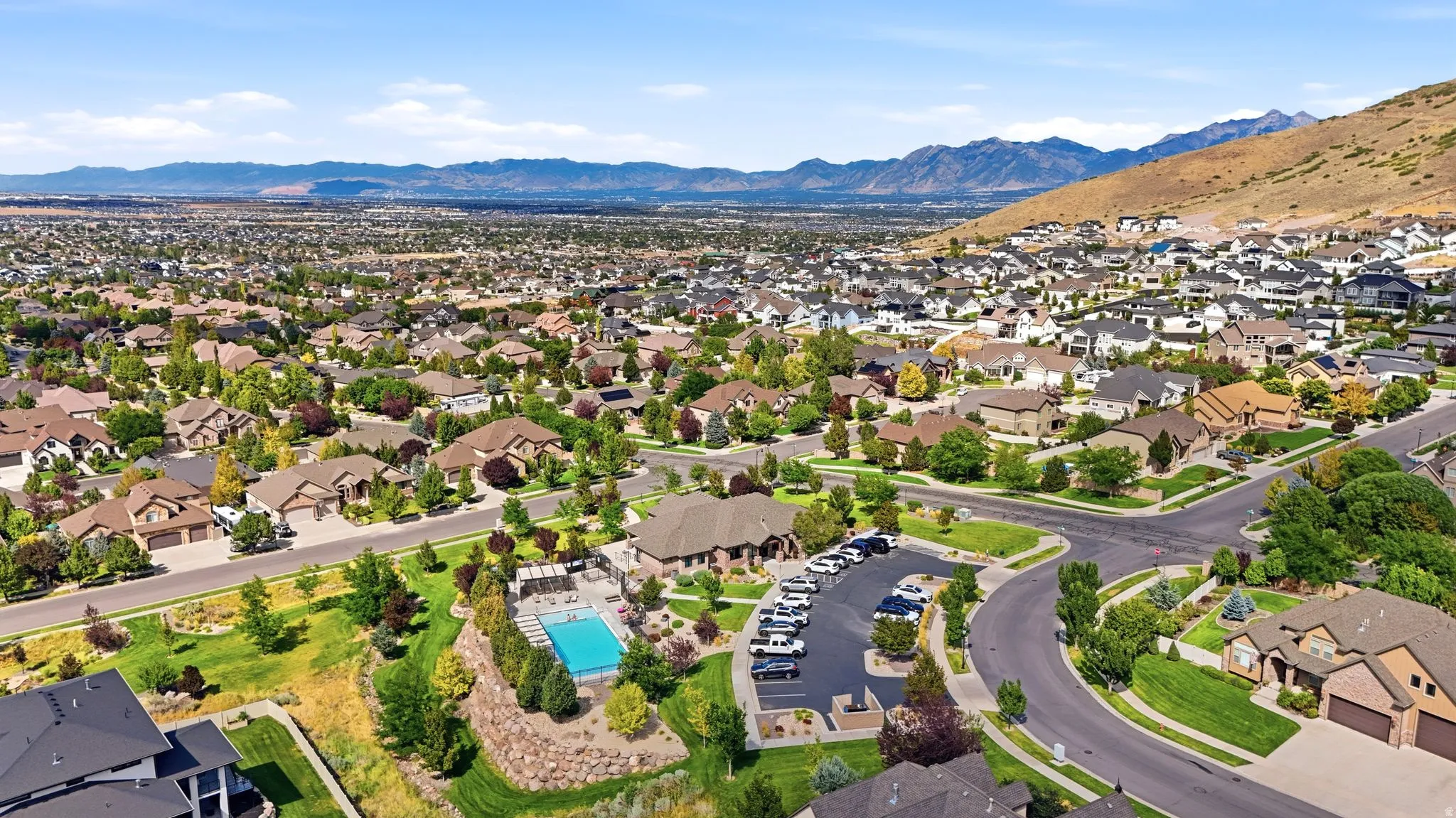 Expansive neighborhood with diverse residential architecture and mature landscaping