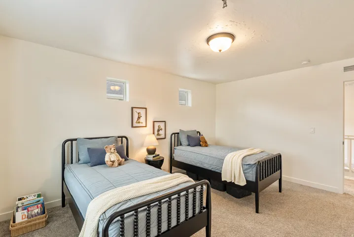 Recessed window openings, ceiling-mounted light fixture, carpeting, and light wall finishes