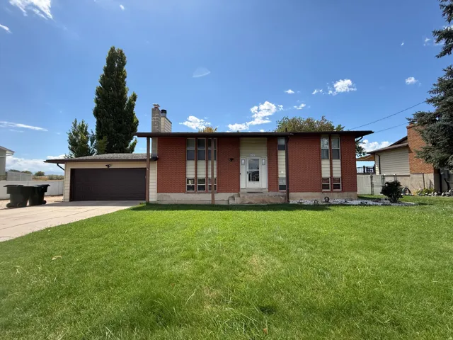 Brick and siding exterior with a two-car garage