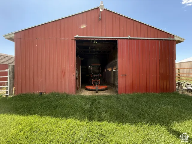 Red metal-sided barn with a gable roof