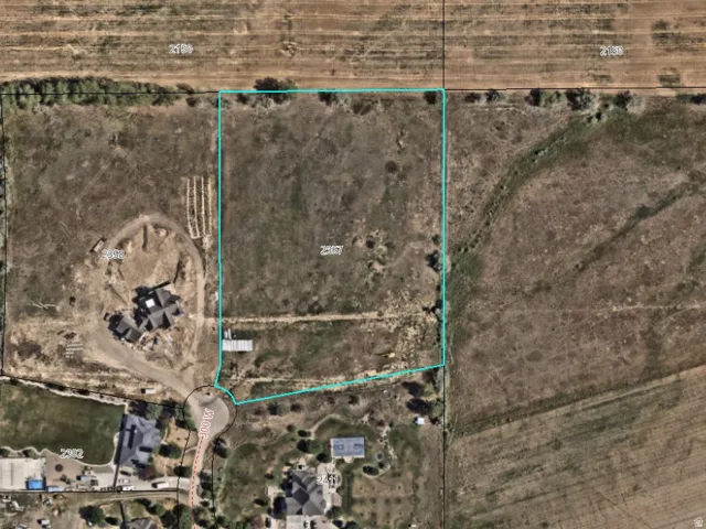 ArcGIS Web AppBuilder Map. Aerial view of the property and surrounding parcels, including roads and scale information