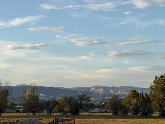 Expansive natural landscape with distant mountain formations