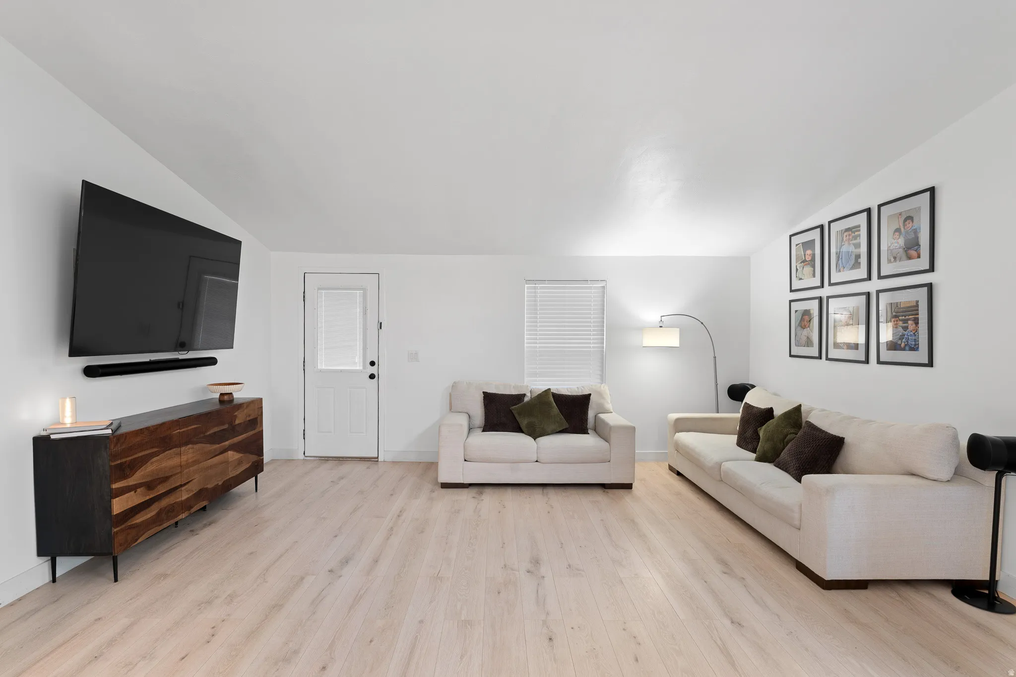 Bright interior with light wood-finish flooring and white walls