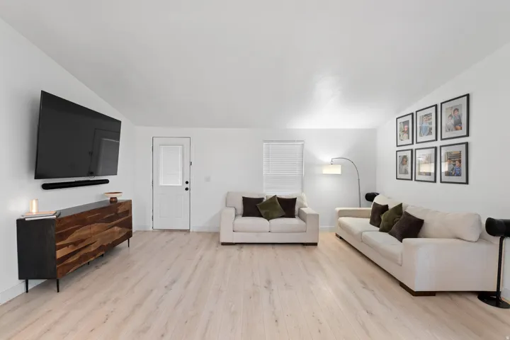 Bright interior with light wood-finish flooring and white walls