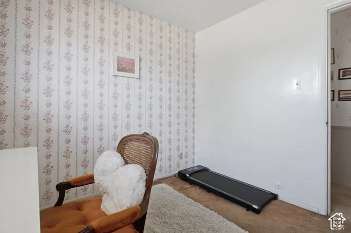 Wallpapered accent wall with floral pattern
