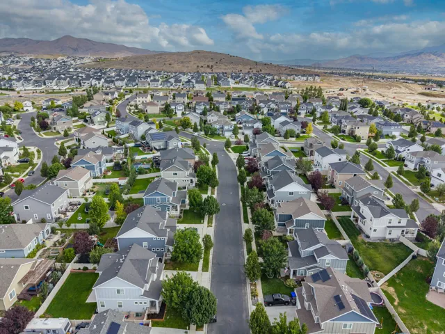 Expansive residential development featuring numerous single-family homes, mature landscaping, and paved streets