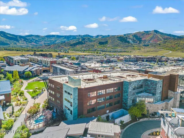 Mountain backdrop with expansive green spaces