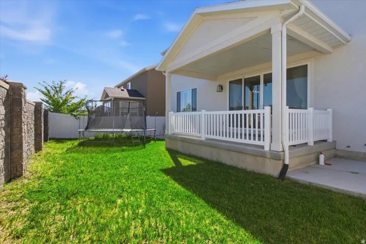 Covered patio with white railing
