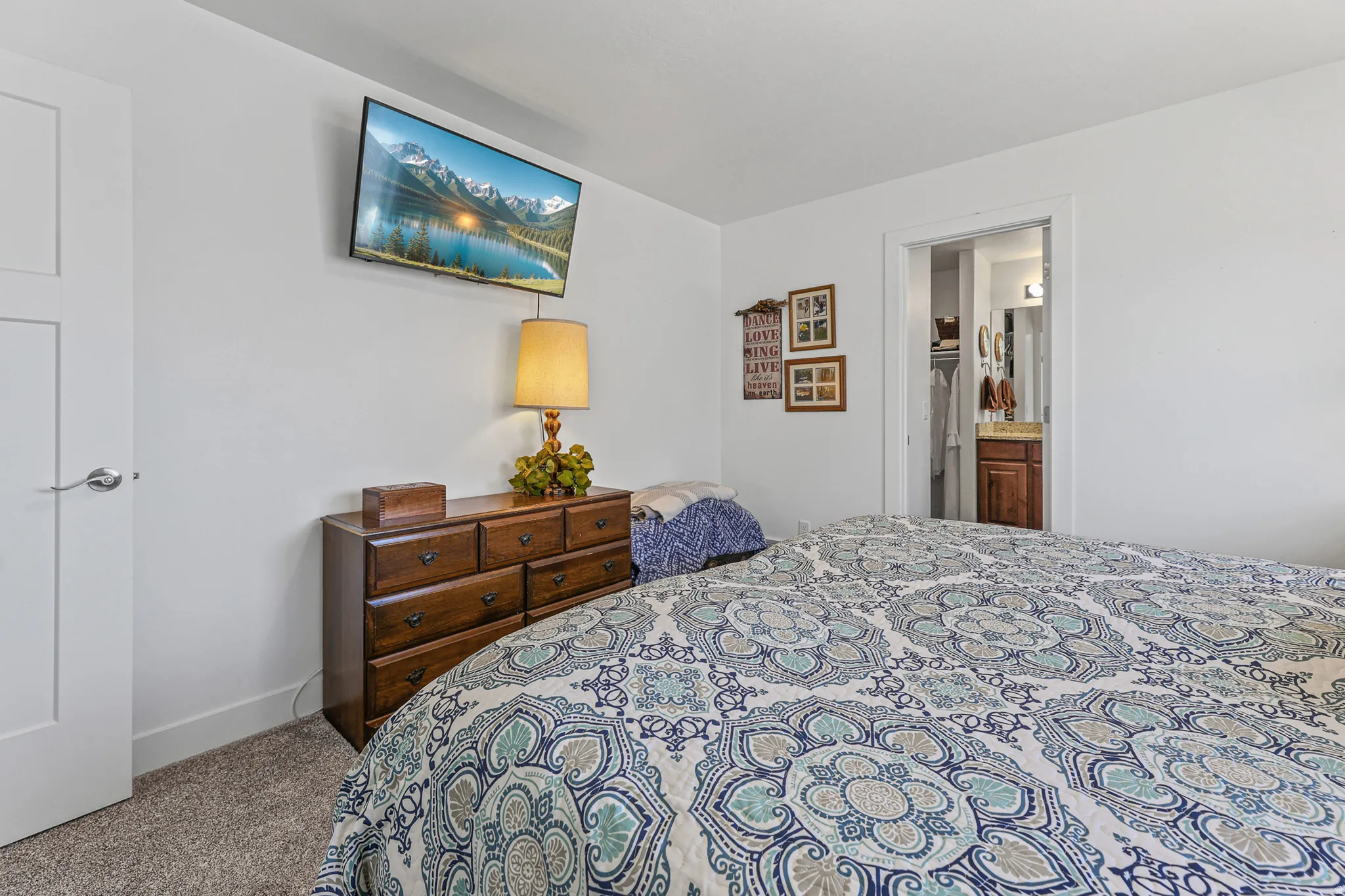 White walls with a contrasting dark wood-finish dresser