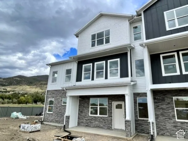 Two-story exterior with horizontal siding and board-and-batten accents
