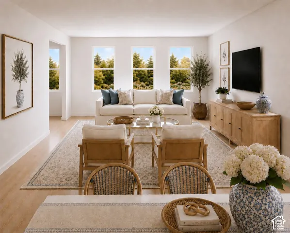 Rendering of the bright and open living space looking from the dining room table.