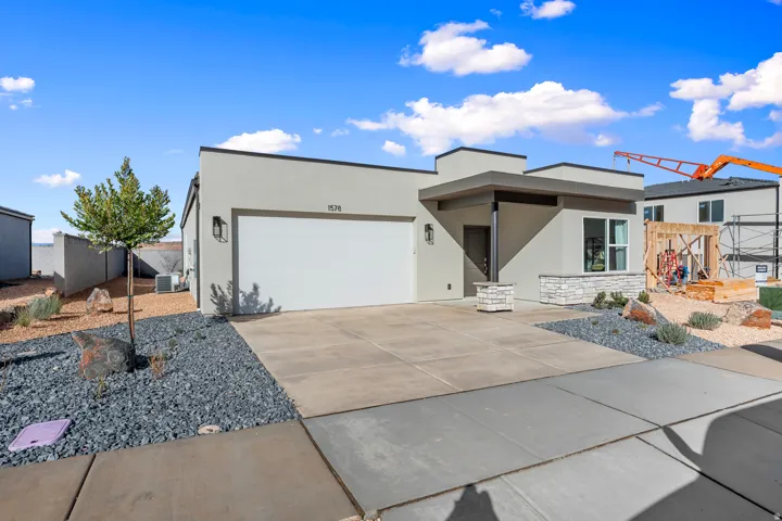 Contemporary exterior with a flat roofline and stucco finish