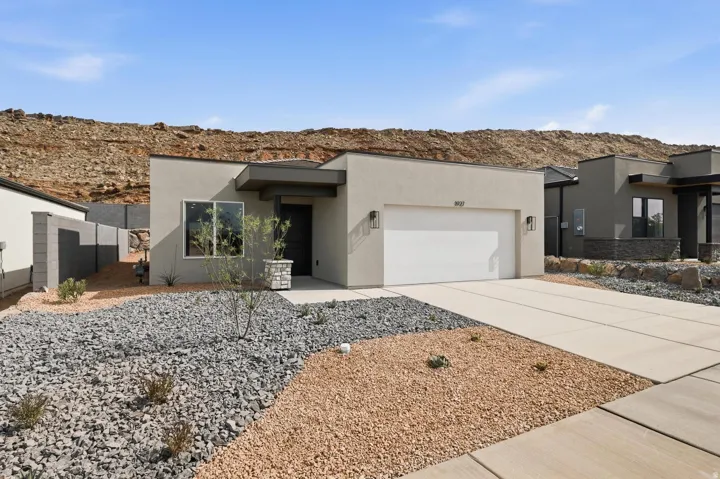 Contemporary stucco exterior with flat roofline