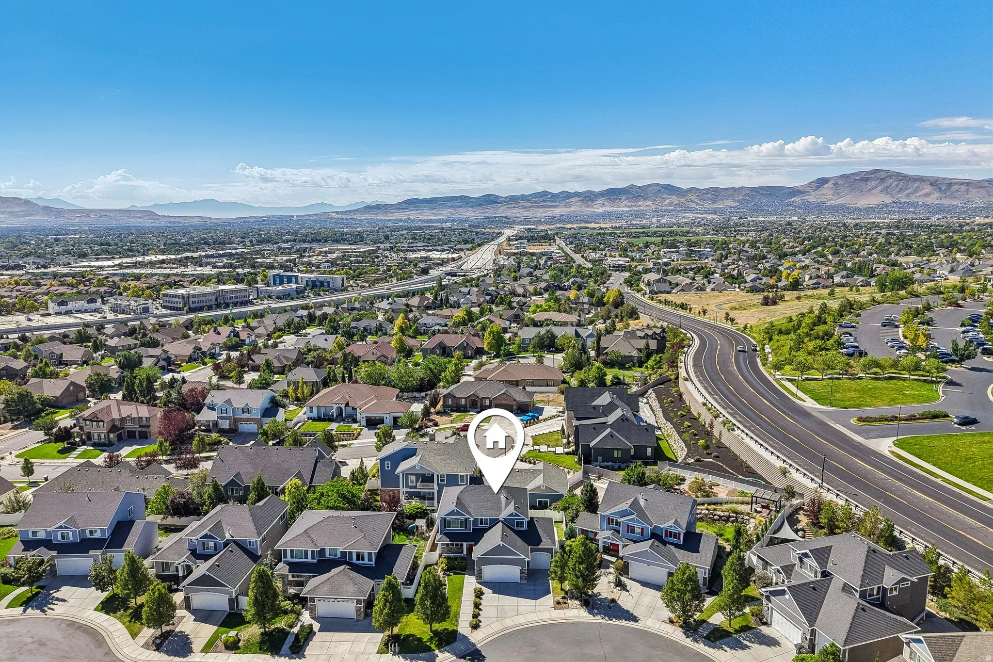 Residential neighborhood with established homes, expansive urban and mountain scenery, and proximity to major roadways