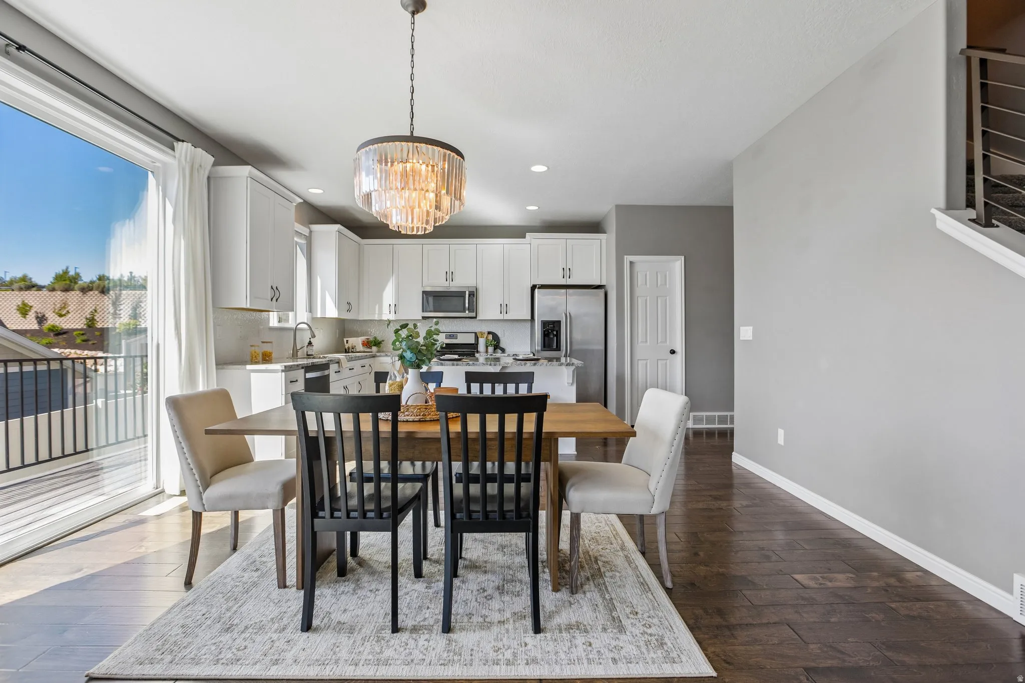 Open-concept living space with dark wood-finish flooring
