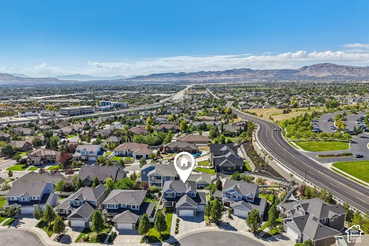 Residential neighborhood with established homes, expansive urban and mountain scenery, and proximity to major roadways