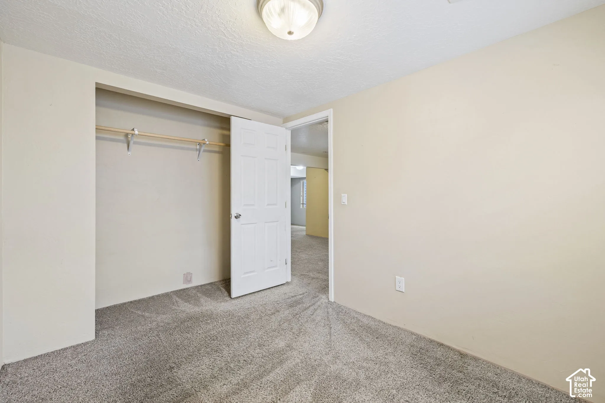 Wall-to-wall carpeting with neutral wall tones