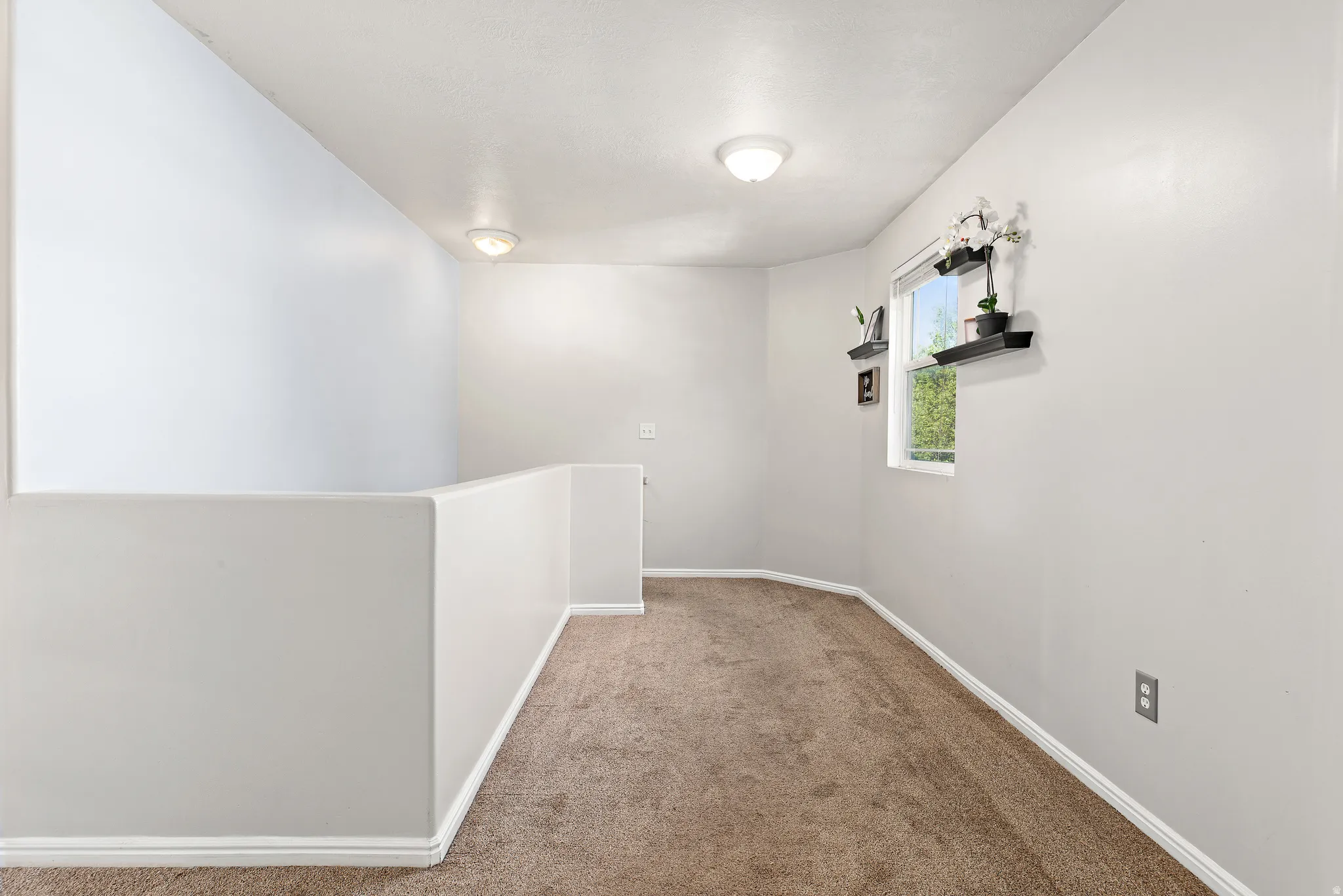 Spacious landing at the top of the stairs, large enough for a small office