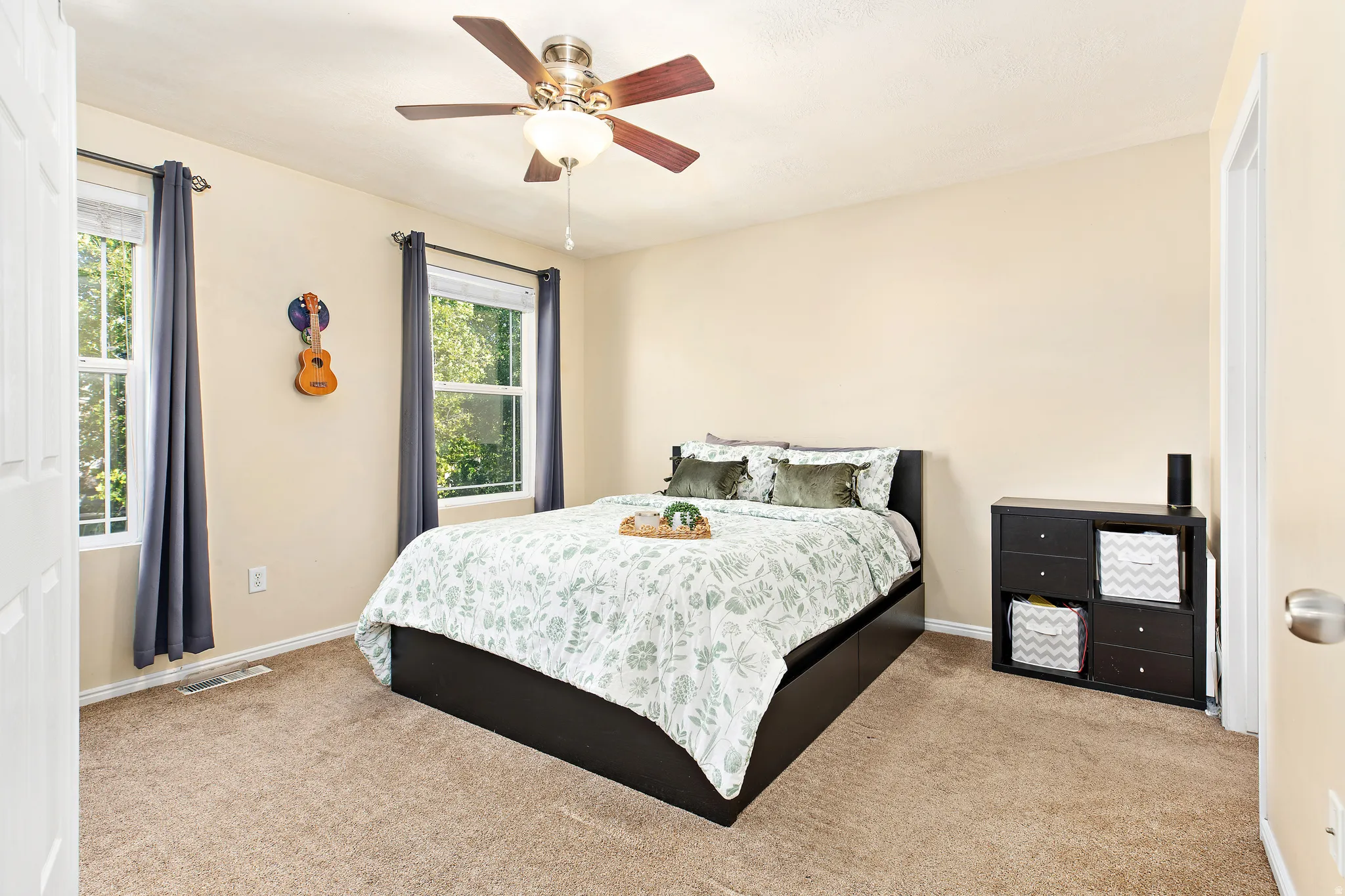 Oversize primary suite with double doors offers with a comfortable retreat with a walk-in closet and private en-suite bathroom.