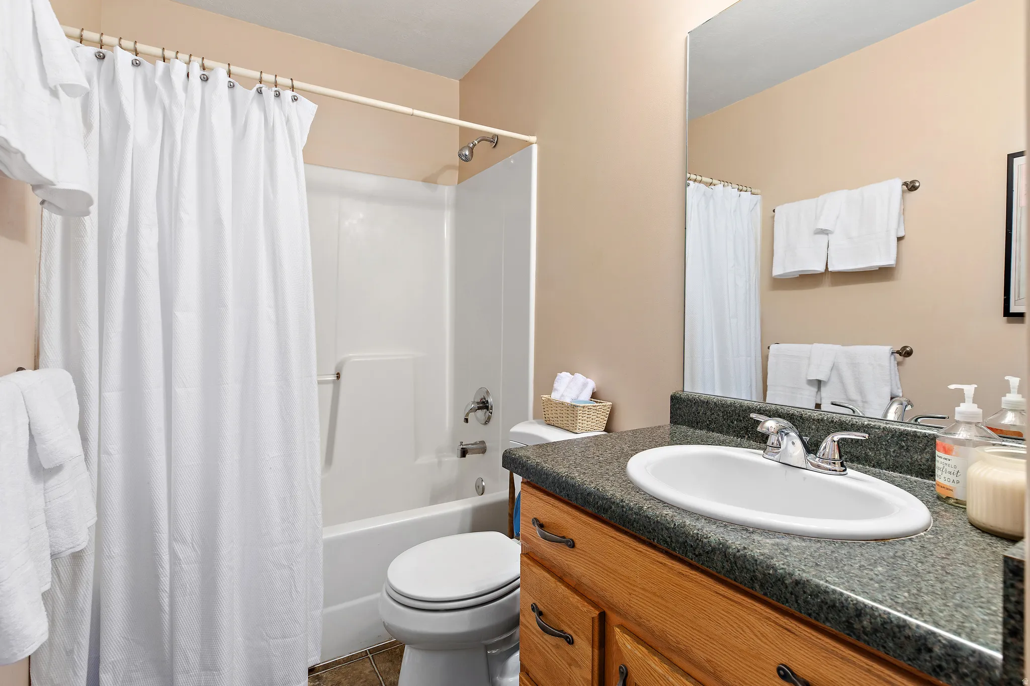 Second bathroom upstairs by bedrooms and laundry room