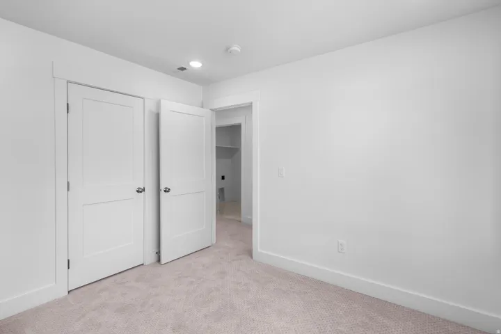 Soft-pile carpeting, recessed lighting, and two-panel interior doors
