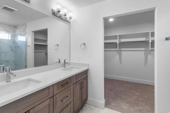 Dual vanity with undermount sinks and chrome fixtures