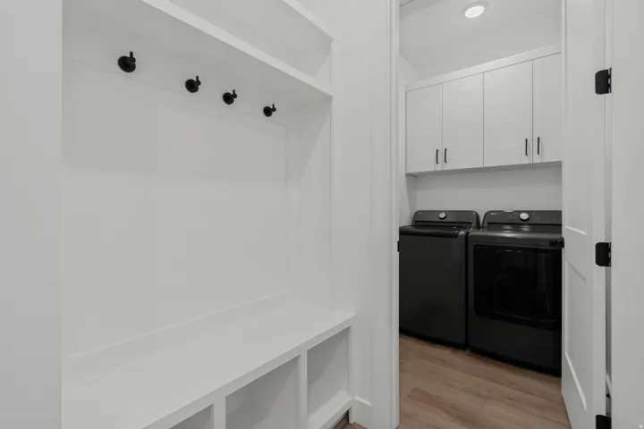Built-in bench with storage cubbies and wall hooks