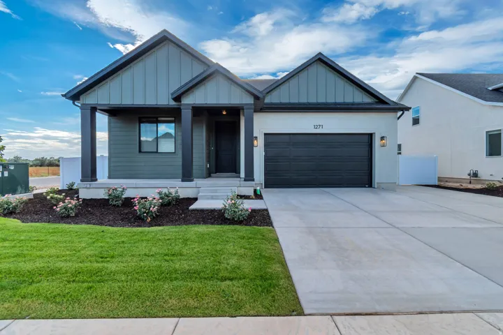 Modern exterior with vertical siding and stucco finishes