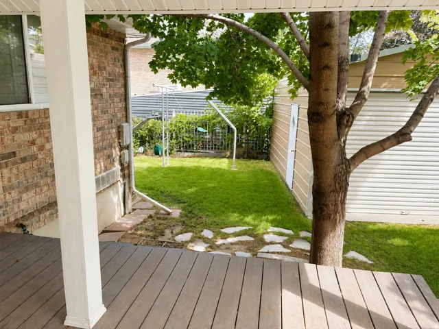 Wood-finish composite decking with a white support column