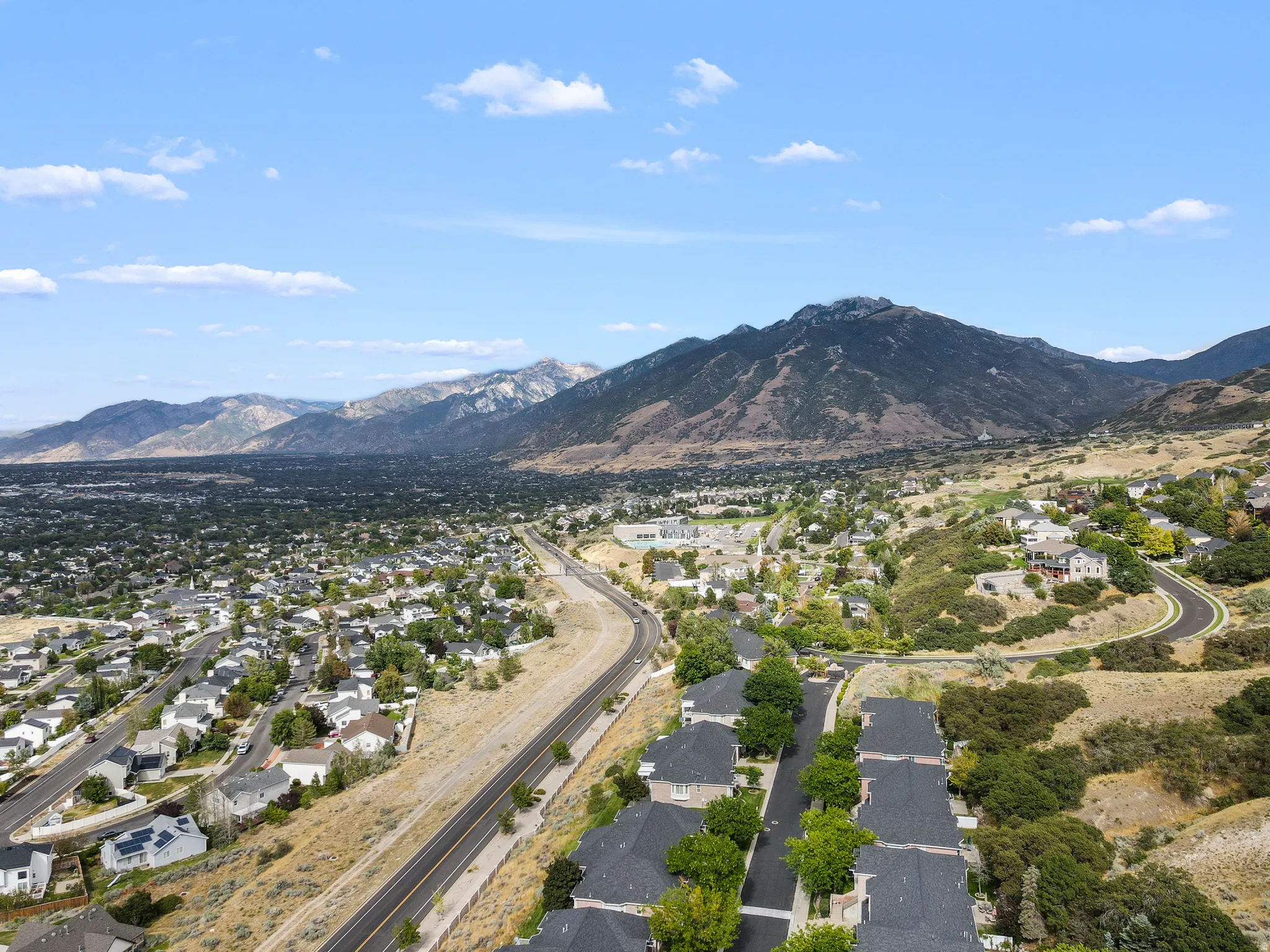 Expansive mountain backdrop with a developed residential area