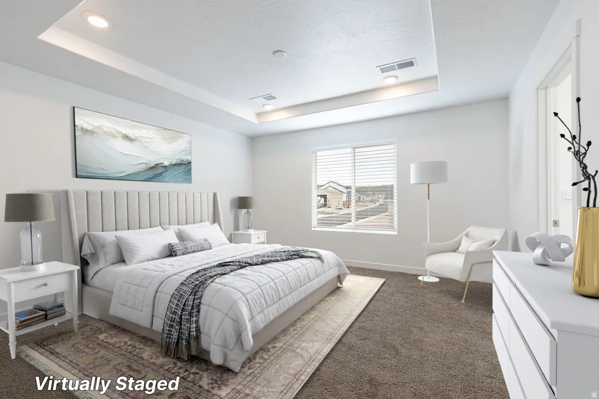 Tray ceiling with recessed lighting and crown molding