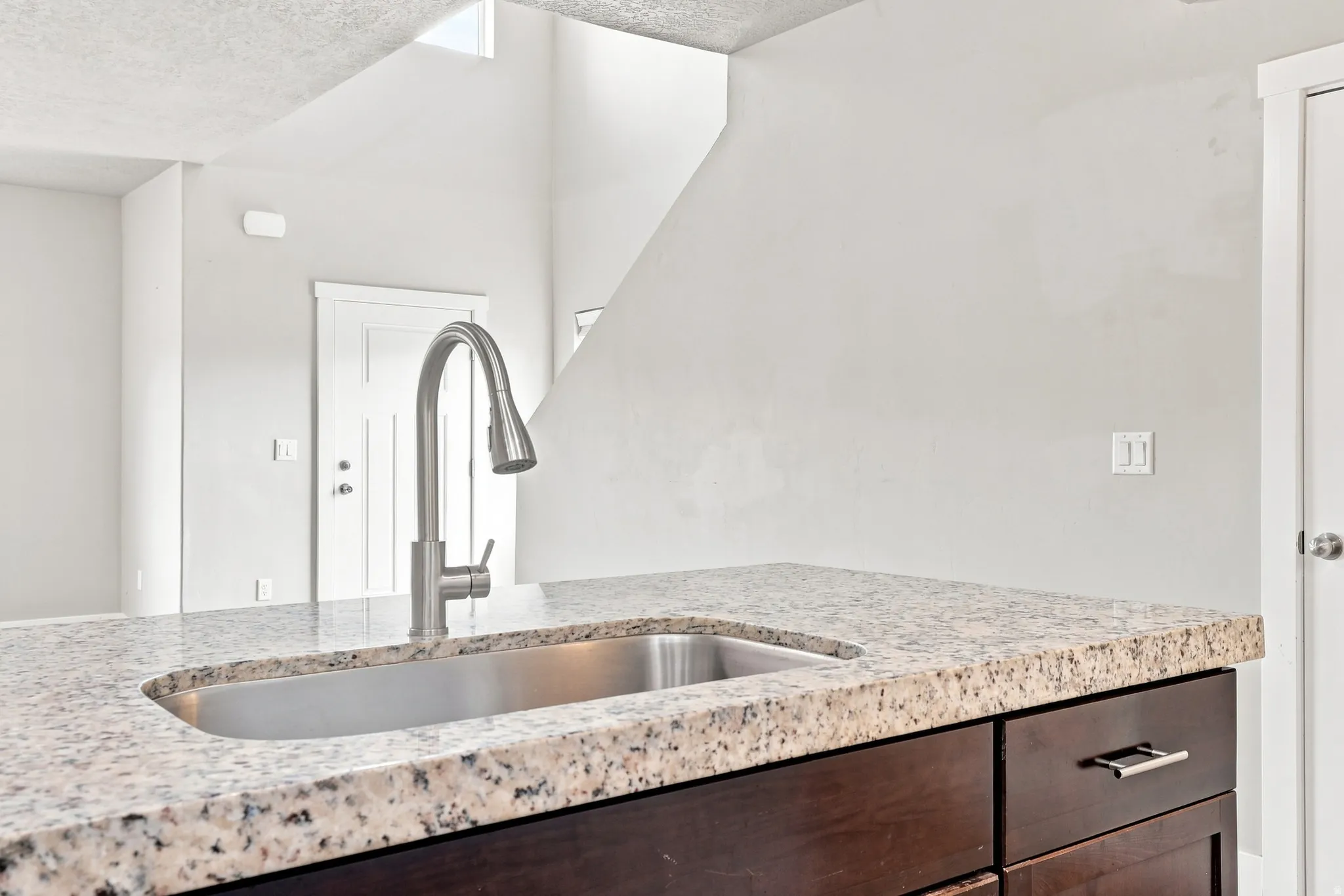 Stainless steel undermount sink with a gooseneck faucet