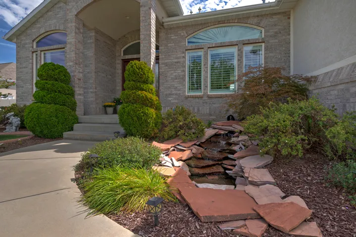 Brick exterior with an arched entryway and covered porch