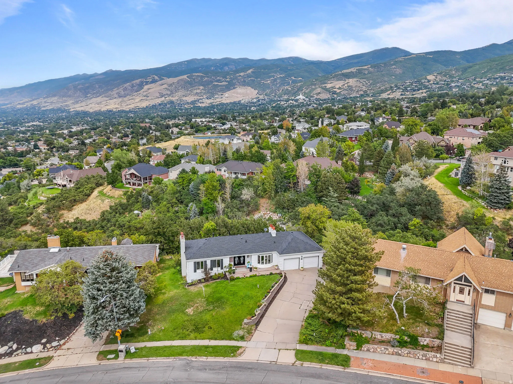 Expansive mountain backdrop with a residential setting