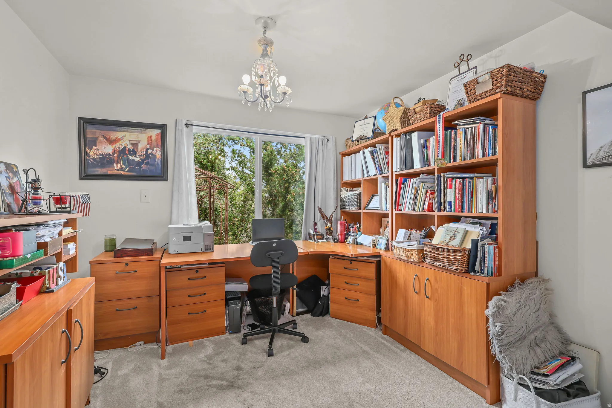 Full-light windows, wall-to-wall carpeting, and a crystal chandelier