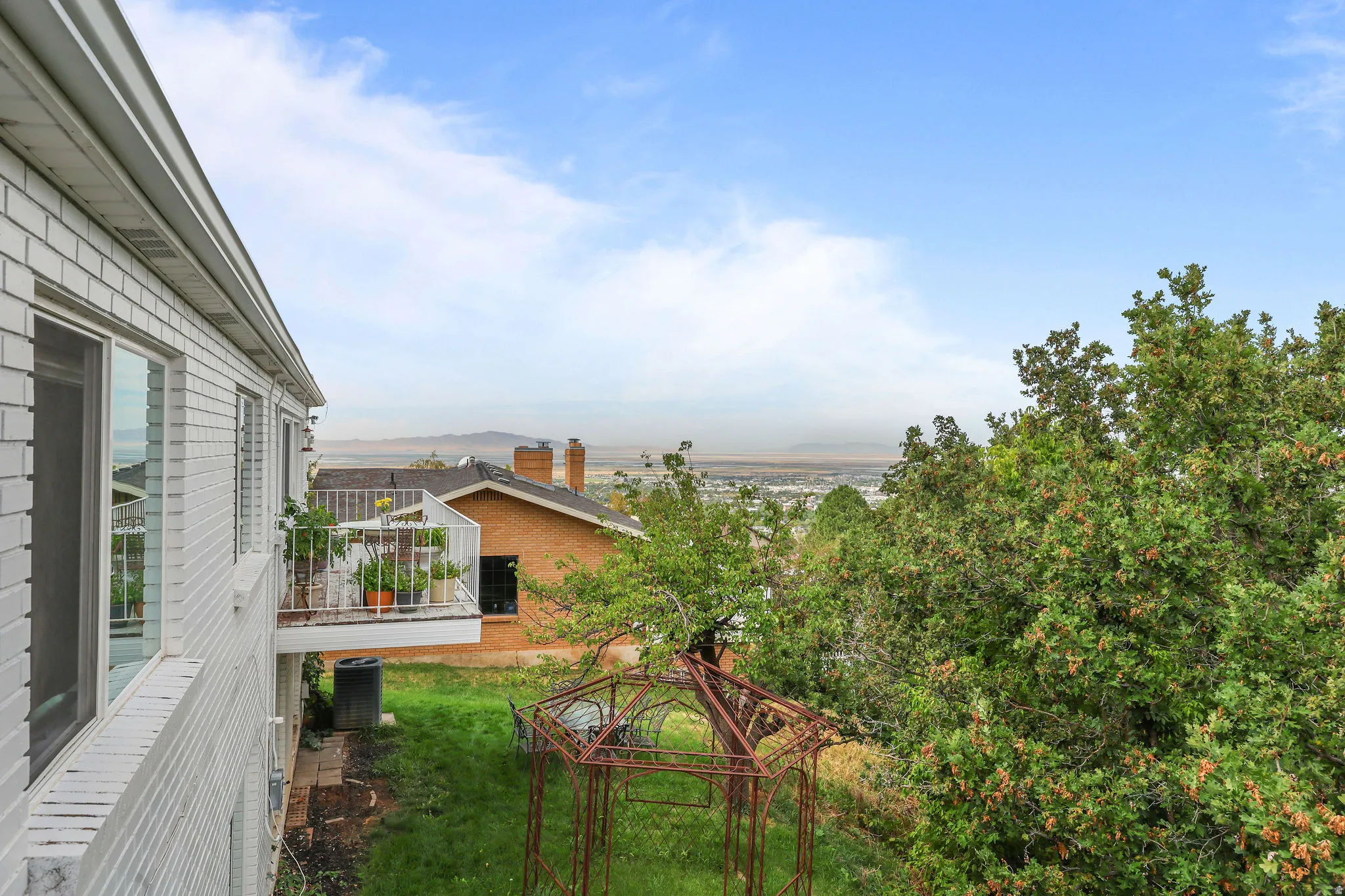 White brick exterior with multiple windows