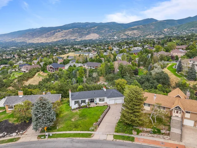 Expansive mountain backdrop with a residential setting