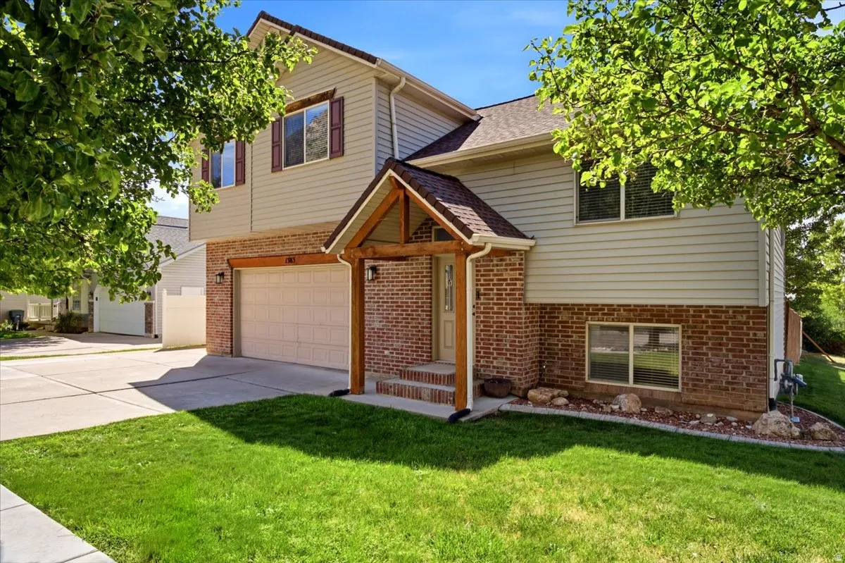 Brick and siding exterior with a covered entry