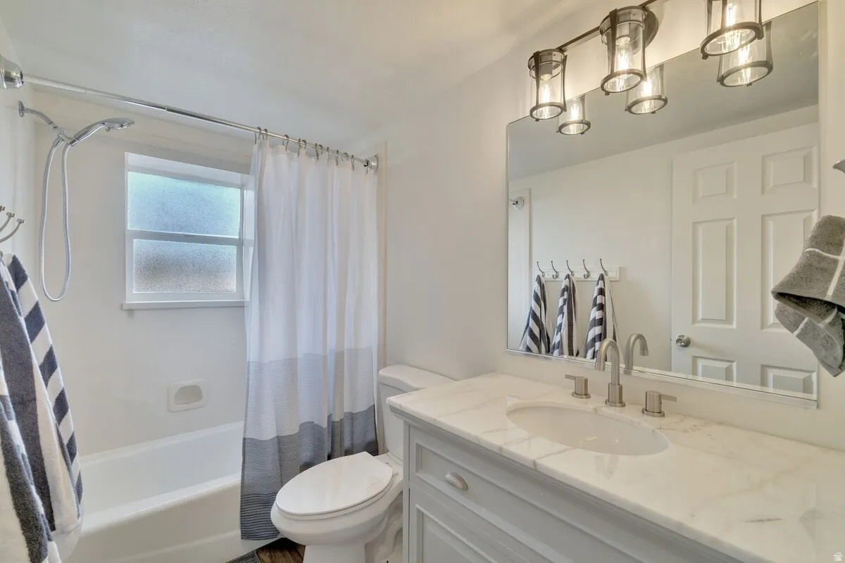 White bathtub with a chrome showerhead