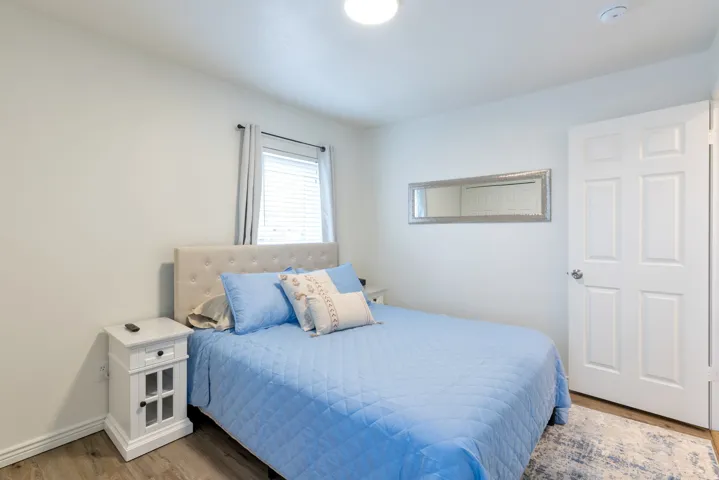 Recessed lighting, wood-finish flooring, and window with blinds