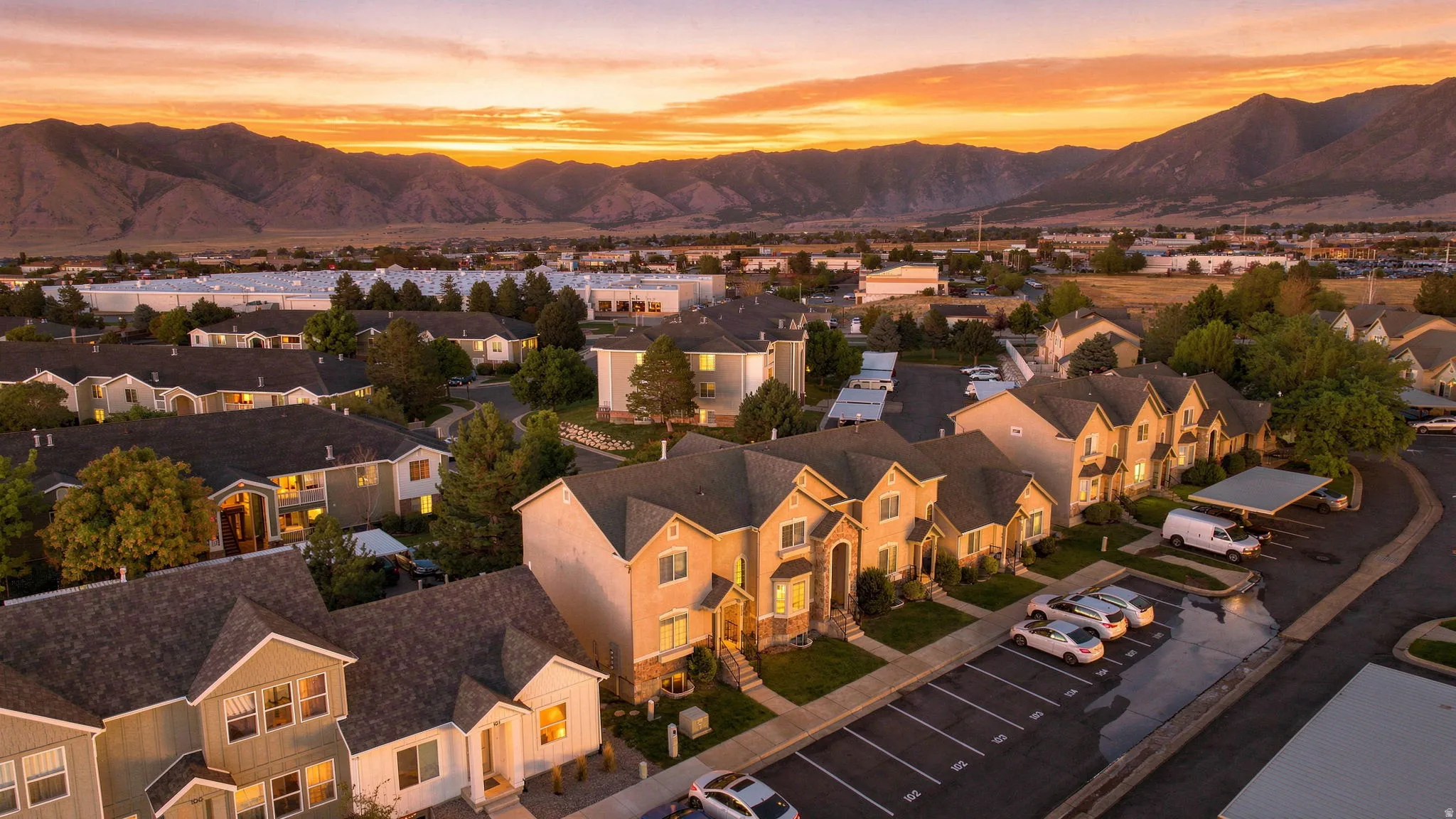 Aerial perspective of a neighborhood with mountain backdrop