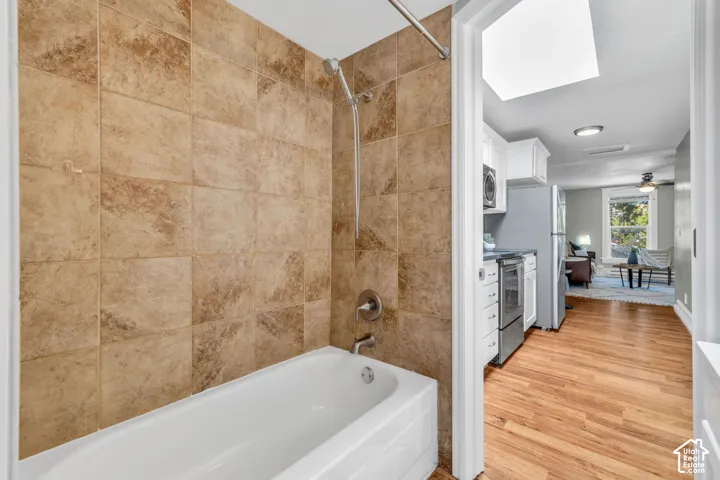 Tub and shower combination with full-height wall tiling