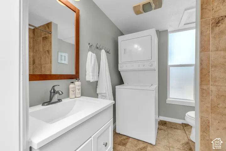 Vanity with an integrated sink and brushed nickel faucet