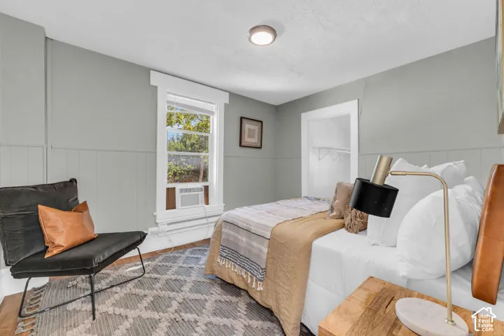 Painted paneling with a window and a recessed closet opening