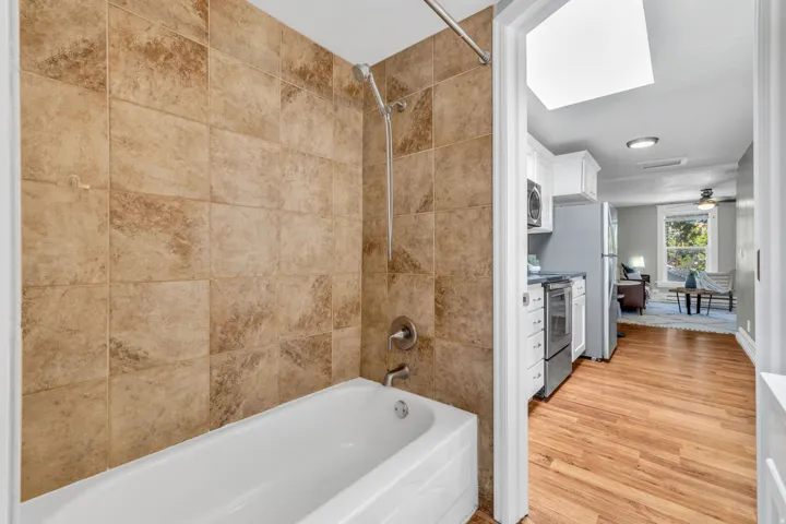 Tub and shower combination with full-height wall tiling