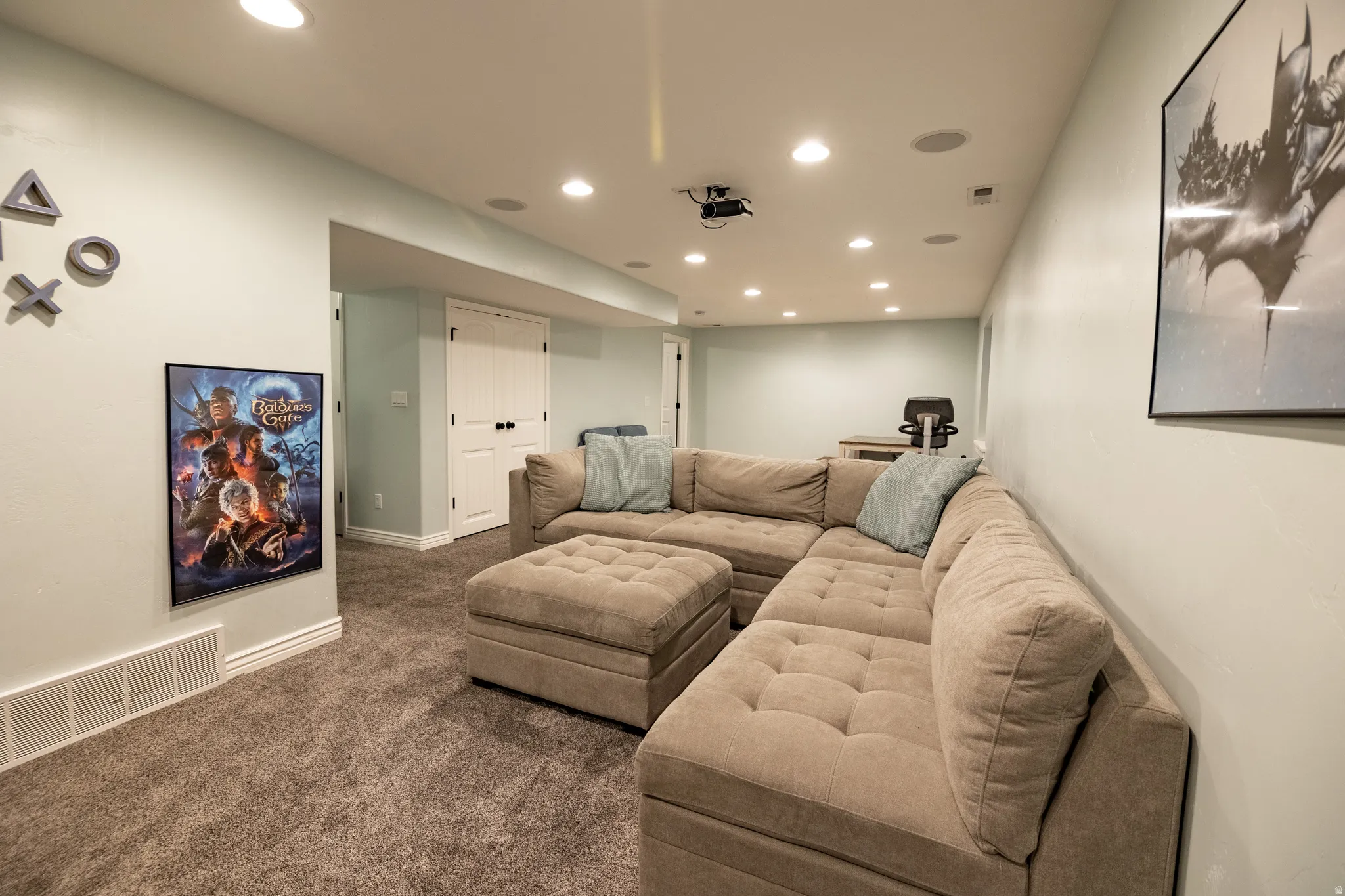 Recessed lighting, ceiling-mounted speakers, and a ceiling-mounted projector