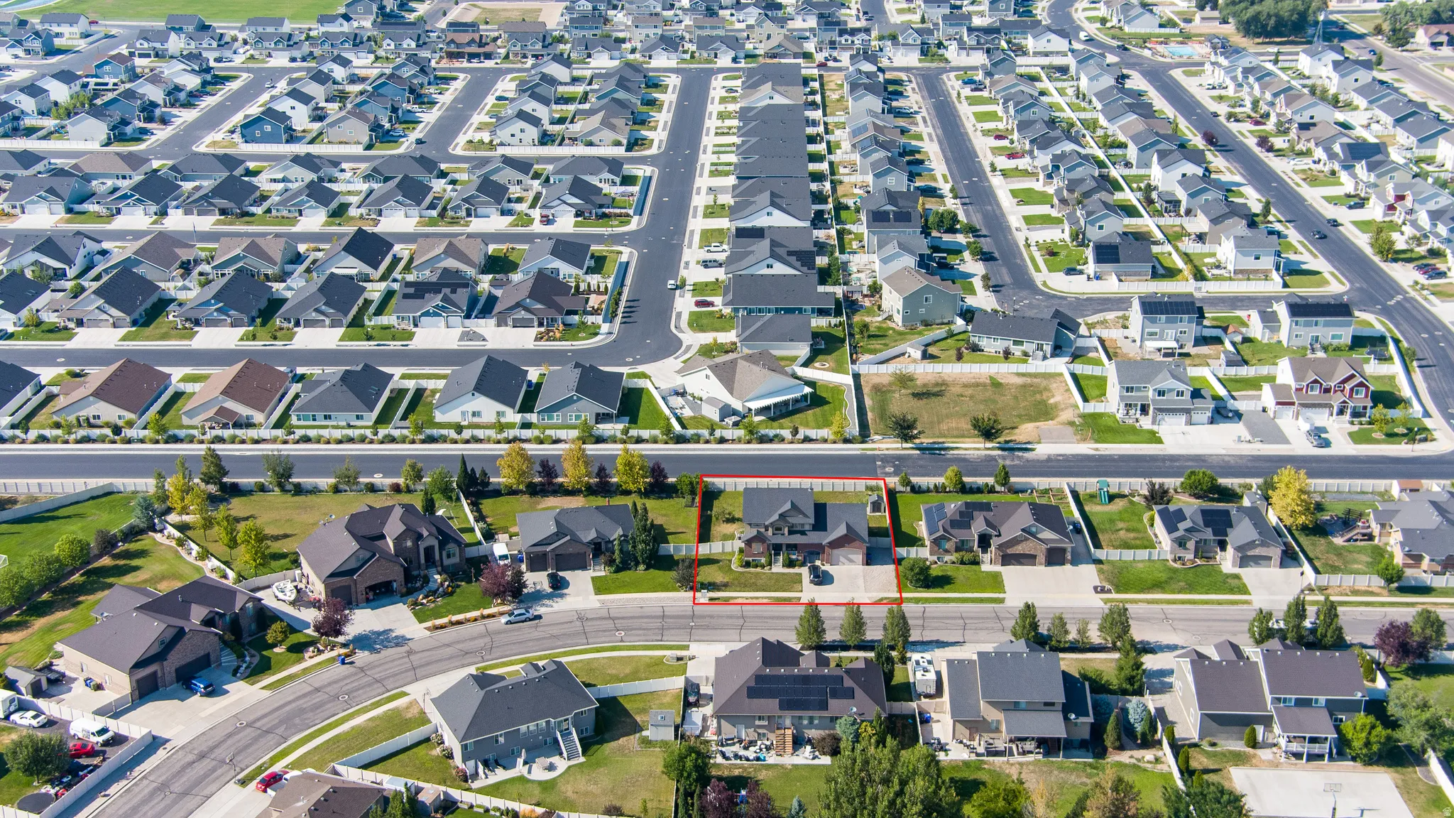 Aerial perspective of a developed residential area with numerous single-family homes