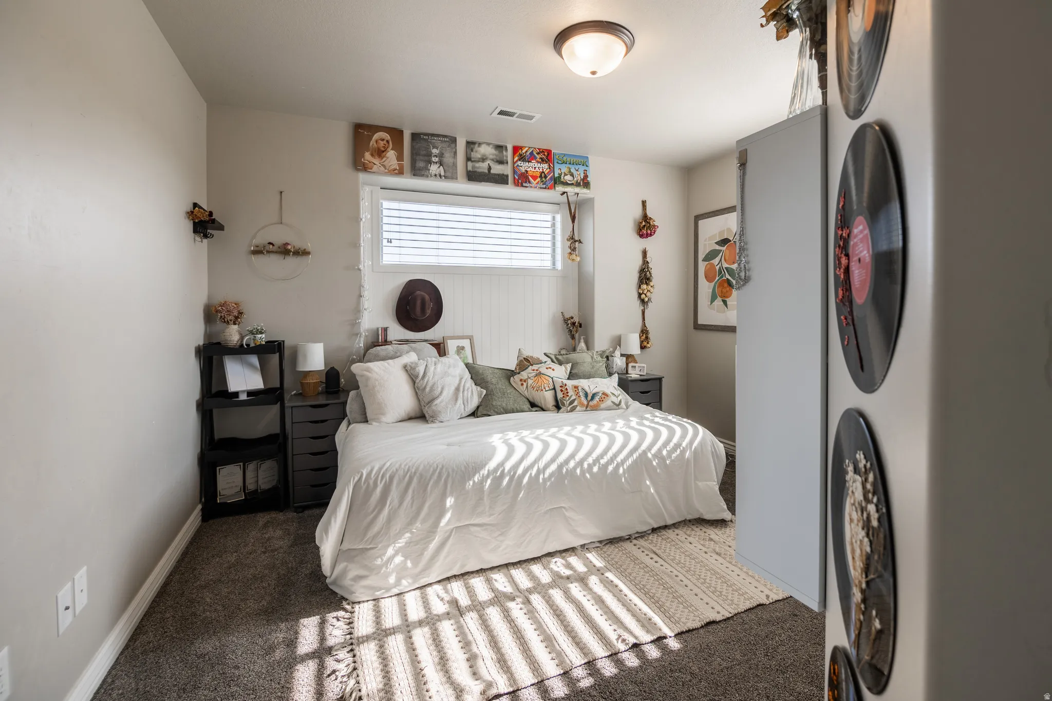 Recessed window with horizontal blinds, shiplap accent wall, and a flush mount ceiling light fixture