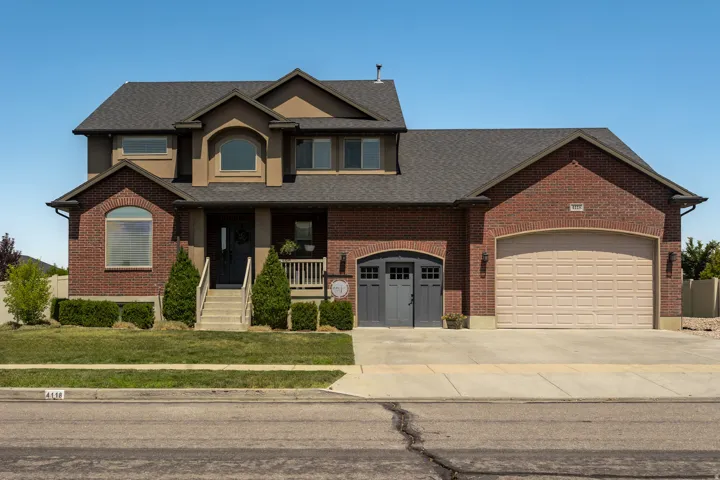 Brick and stucco exterior with multiple gables