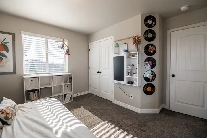 Window with horizontal blinds, neutral wall paint, and plush carpet flooring